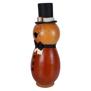 A charming pilgrim man gourd hand carved and painted in amber with a black top hat by meadowbrooke gourds artisans