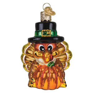 Pilgrim turkey ornament glass christmas glass ornament with black hat and green band holding orange pumpkin turkey ornament