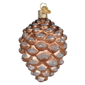 A shimmering rose gold pinecone ornament with silver glitter and a golden heart tag perfect figural decor or tree toppers