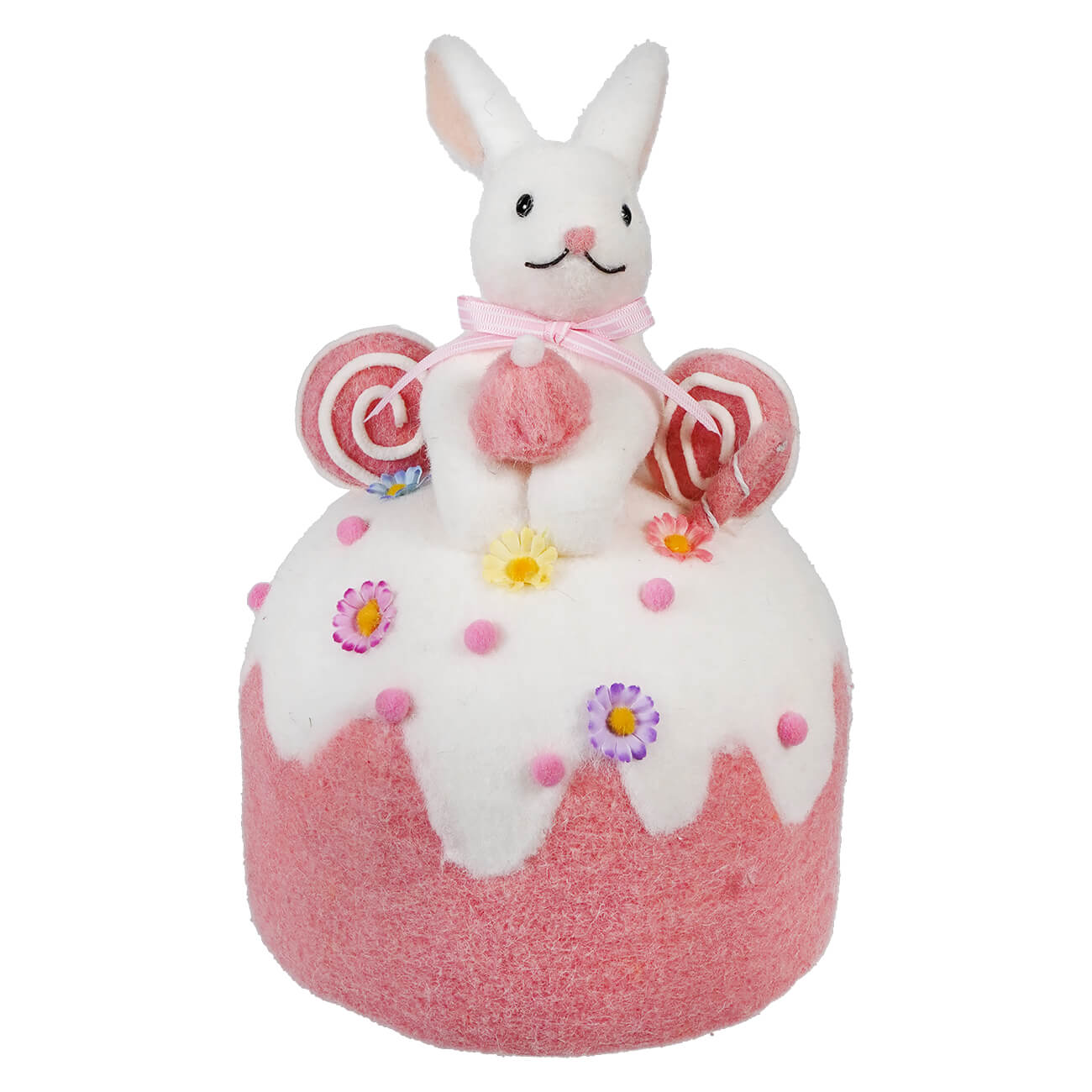 White bunny sitting atop a pink and white decorated cake-shaped ornament with lollipop accents.