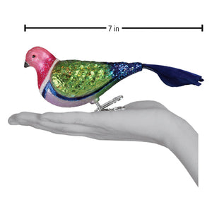 A 7-inch colorful glass pigeon ornament with a pink head green and blue glittery body perfect for figural decor or tree toppers