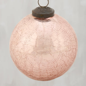 A delicate pink ball glass ornament with crackled texture and dark metal cap perfect for christmas decor