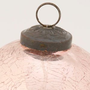 Pink ball glass ornament with crackled texture dark metal cap and hanging ring perfect for christmas decor