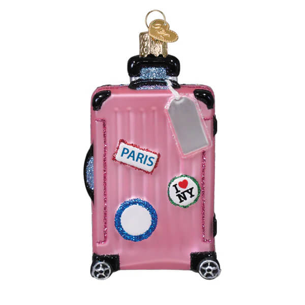 Pink rolling suitcase glass ornament decorated with travel stickers perfect as a fun travel ornament