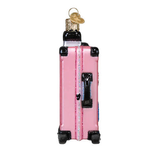 Pink rolling suitcase ornament with glittery finish black trim wheels and handle travel ornament for decor