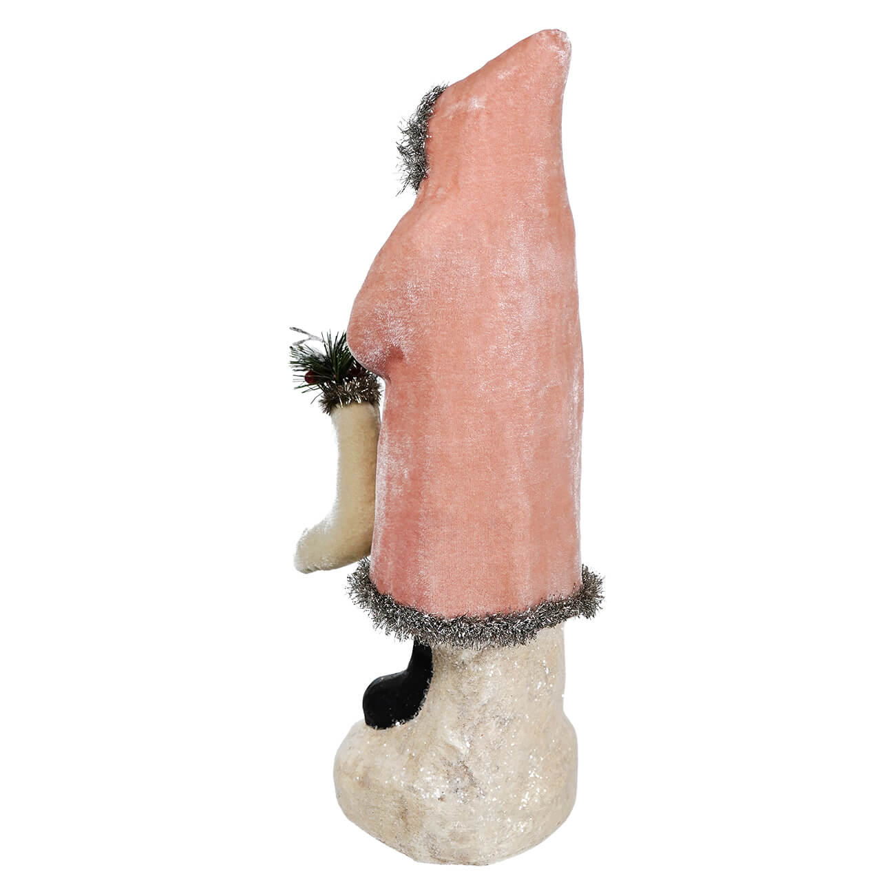 Pink velvet belsnickle figurine with silver tinsel trim holding small evergreen branch on textured base