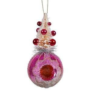 Pink vintage reflector ornament with a frosted tree and shiny red beads on a glittery glass globe perfect for christmas decor