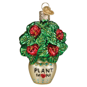 A glossy glass plant mom ornament shaped like a potted plant with green leaves and red flowers, perfect for gardening ornaments