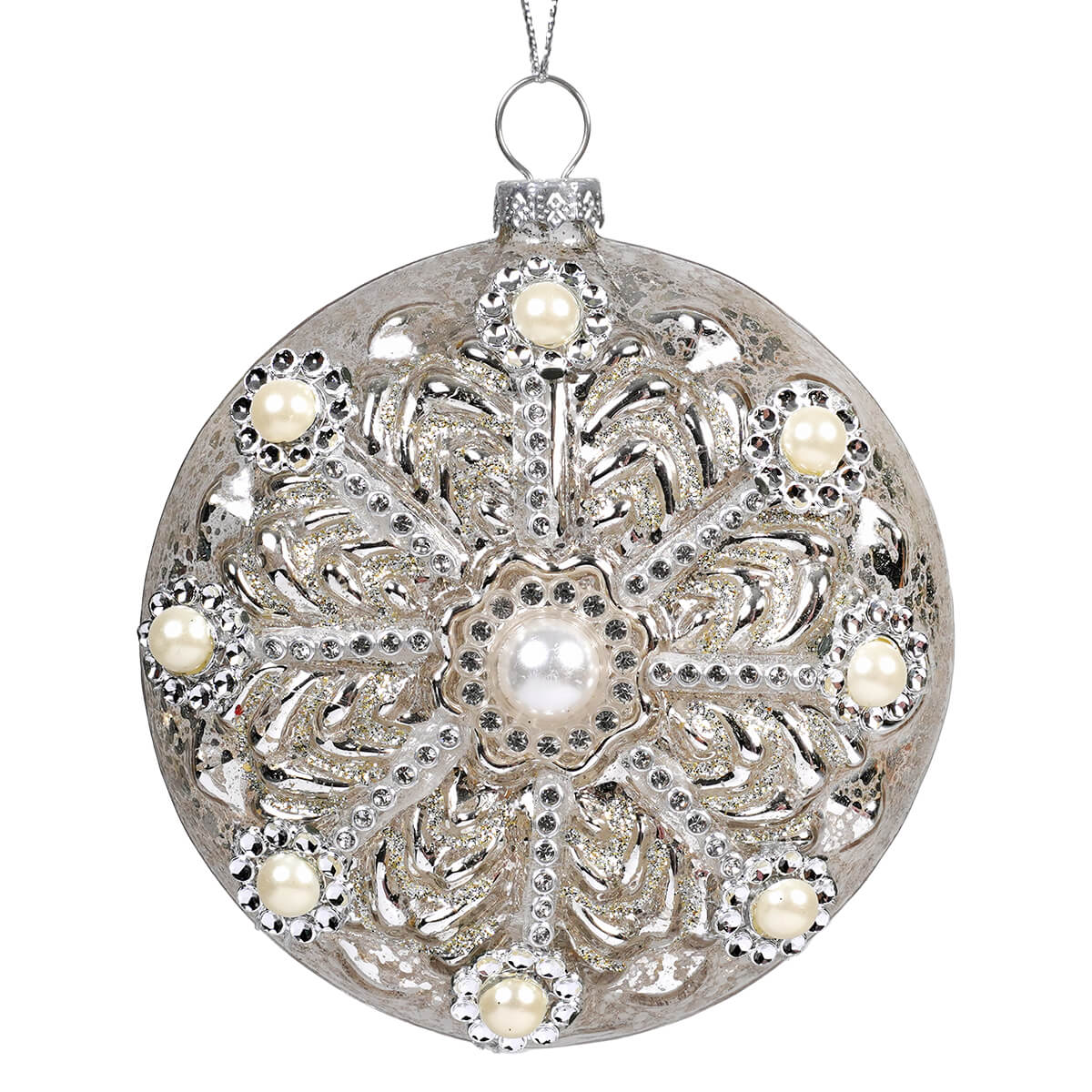 Silver ornamental christmas bauble with intricate filigree, embedded pearls, rhinestones on gold glass gilded pearl disc