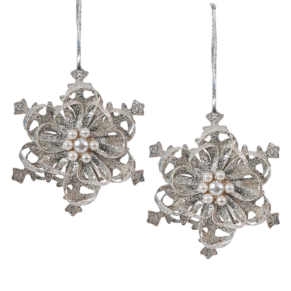 Ornate silver snowflake-shaped Christmas ornaments with pearl-like centers.