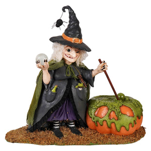 Poison brewing pruella Halloween witch figurine in green robe brewing a potion for spooky decor