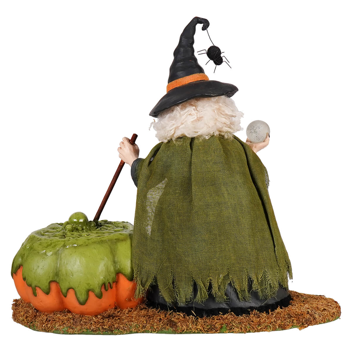A whimsical poison brewing pruella witch figurine with a black hat, white curly hair, burlap cape, broomstick, and pumpkin cauldron