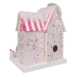 A whimsical white poodle palace birdhouse by cody foster with pink striped awning glittery snow texture and silver chimney