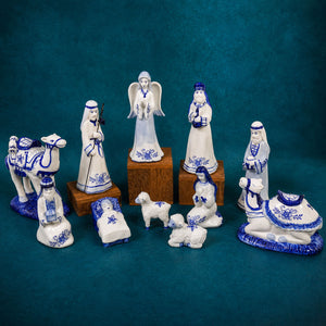 Porcelain delft blue and white nativity set with intricate floral patterns featuring three wise men figurines