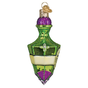 A festive green and purple glass potion bottle ornament with glitter, silver cross, and gold heart tag perfect for tabletop decor and halloween cauldron ornament collections