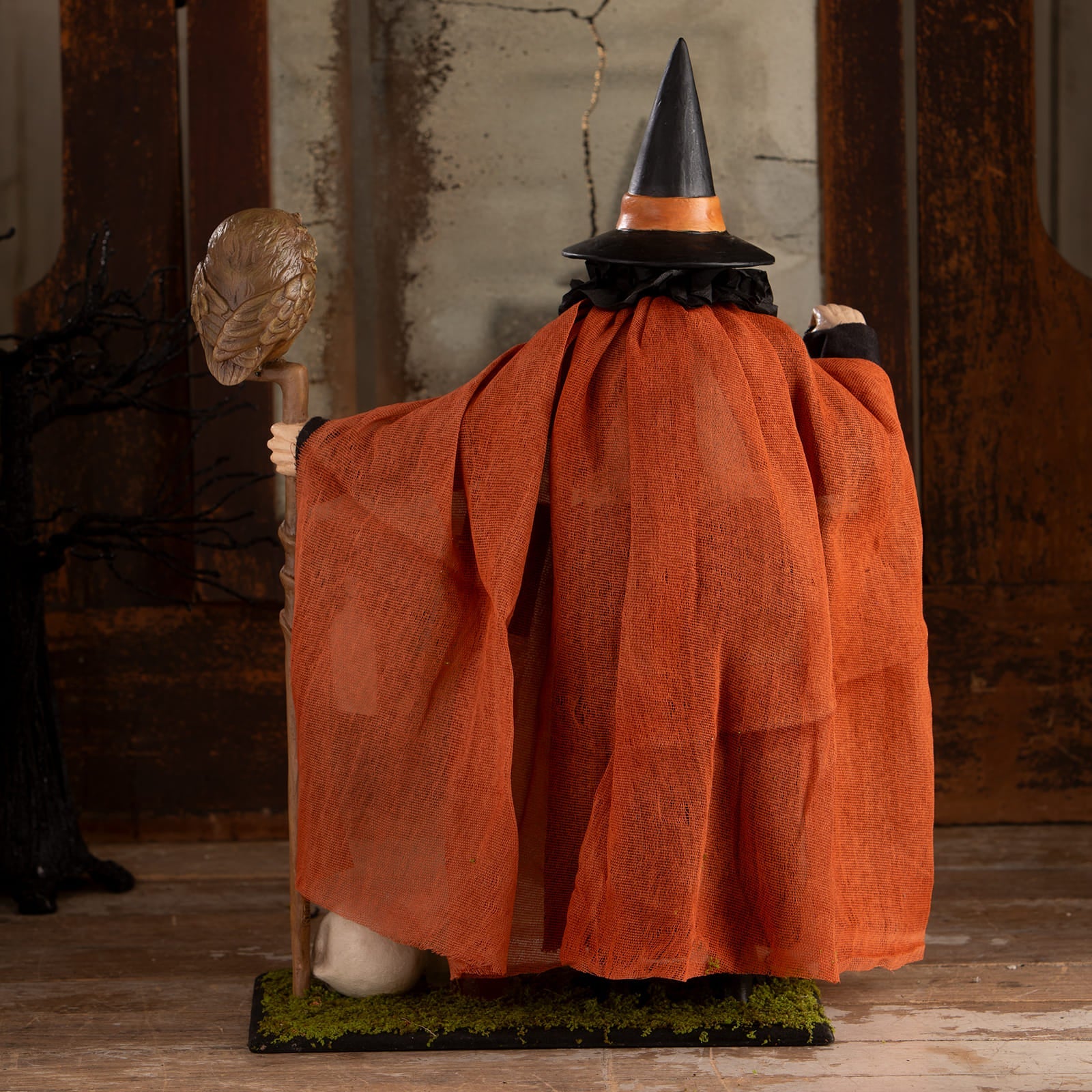 Potion peddler zelda witch figurine with black hat orange textured cape holding skull staff perfect for halloween witches decor