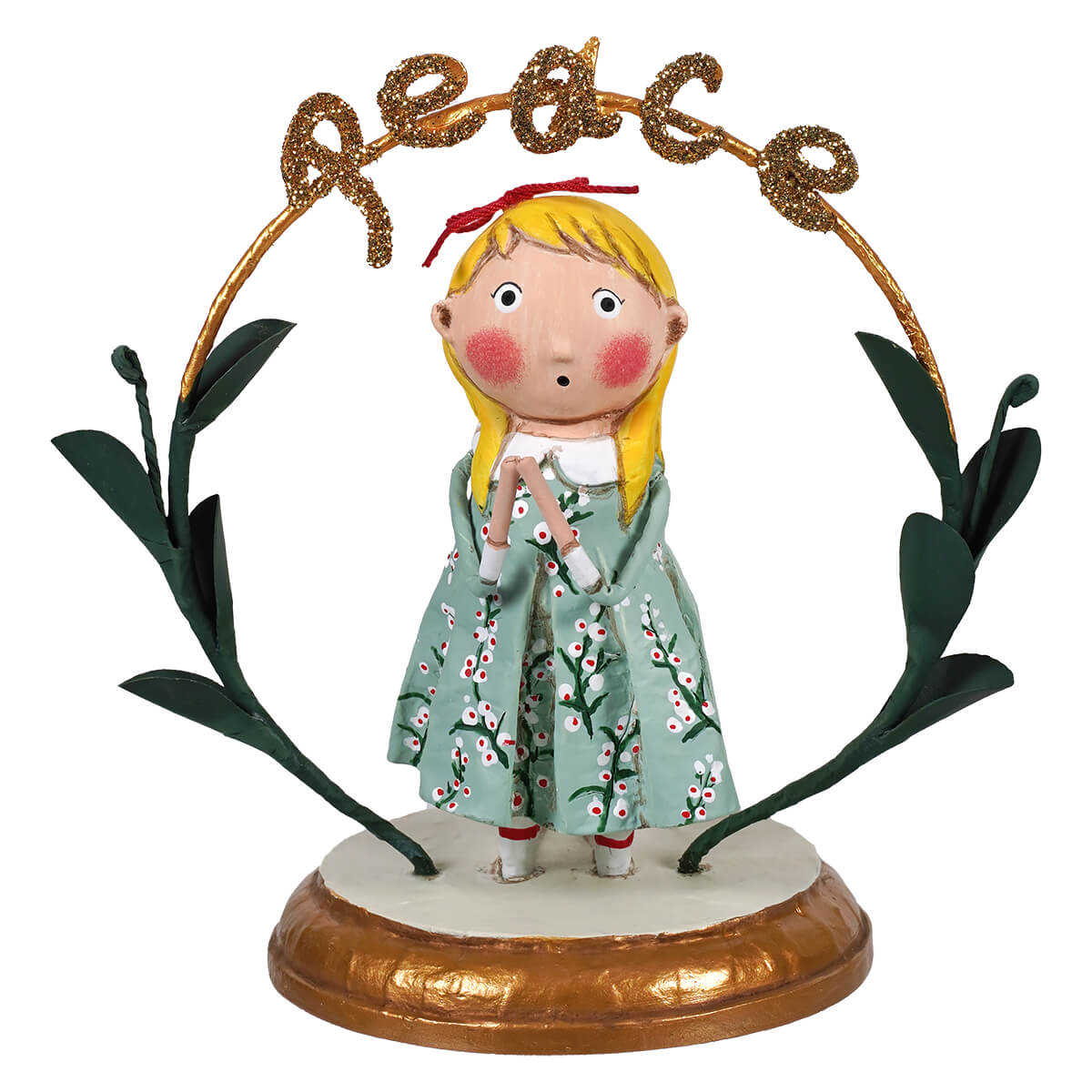 Figurine of a girl under the word peace in a praying for peace child’s christmas figure design
