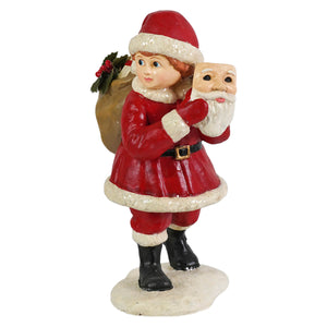 Pretending to be santa red and white bethany lowe designs santa figure holding a mask in festive attire with black boots