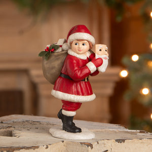Pretending to be santa red and white santa figure with black boots and holly berry sack by bethany lowe designs