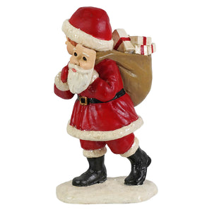 Pretending to be santa red and white bethany lowe designs santa figure with black boots carrying brown sack of gifts
