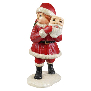 Pretending to be santa red and white santa figure by bethany lowe designs holding a mask with black boots folk art santa