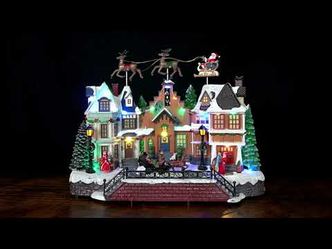 Santa Over Rooftops Lighted Holiday Village Scene