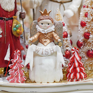 A princess wish angel figurine with a gold crown silver glitter wings and white ruffled collar holding a wish banner