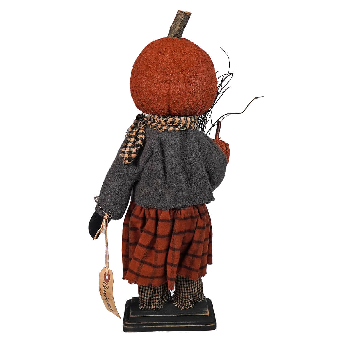 Decorative autumn figure with a pumpkin head wearing a jacket and plaid pants.