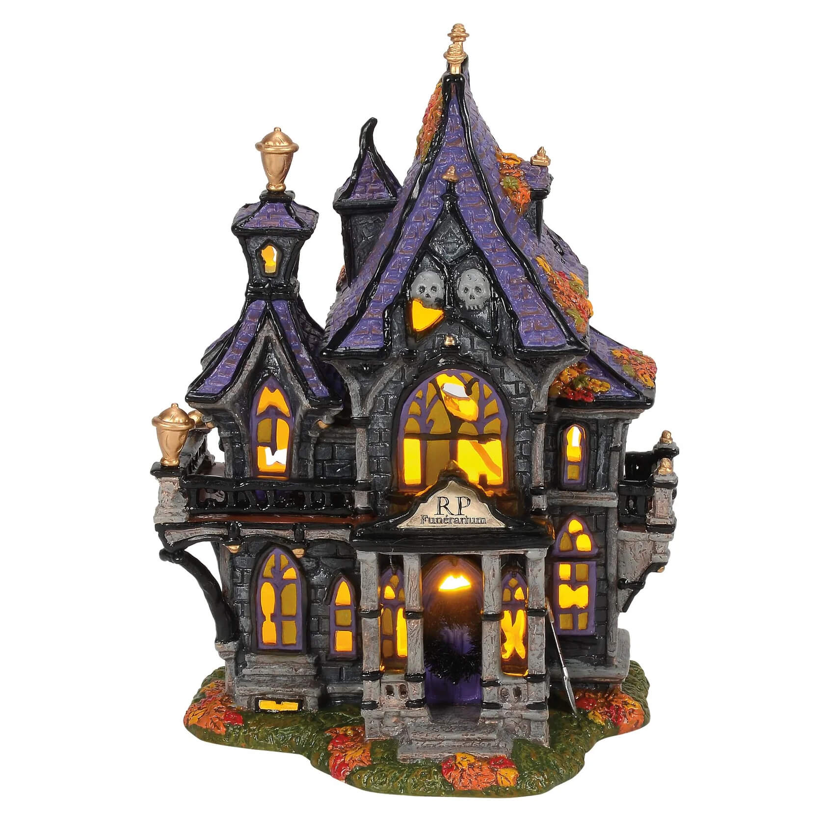 Illuminated halloween haunted house figurine in green and black from puckett’s funerarium for spooky decor
