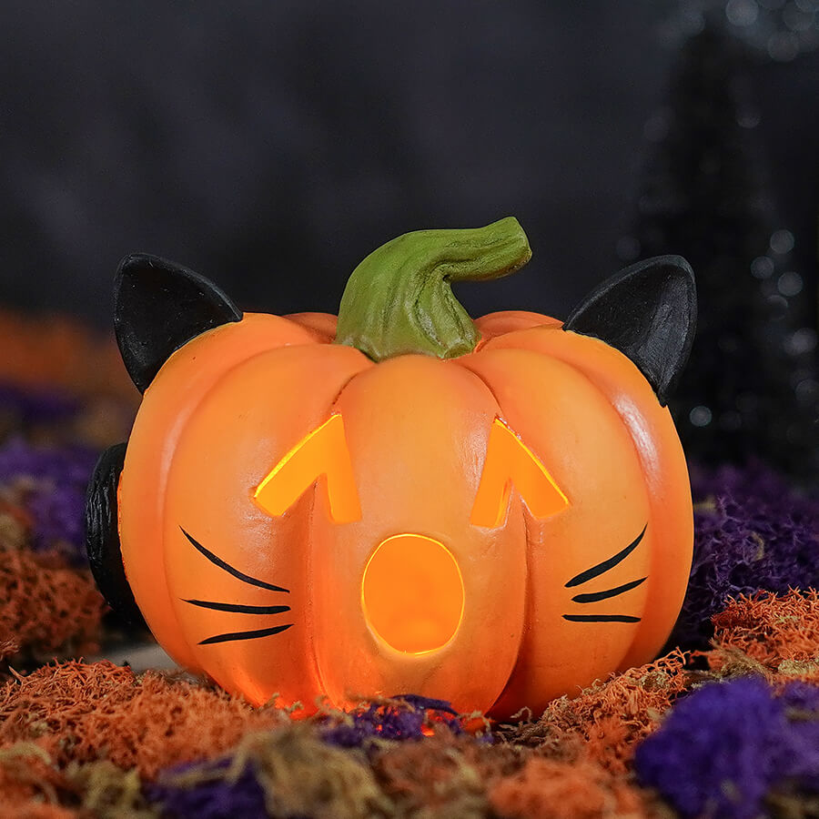 Orange cat-themed pumpkin cat luminary with black ears green stem and glowing face by bethany lowe design in tiny pumpkin form
