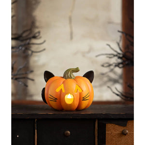 Orange cat-shaped pumpkin cat luminary with black ears and glowing yellow face in tiny pumpkin form by bethany lowe design