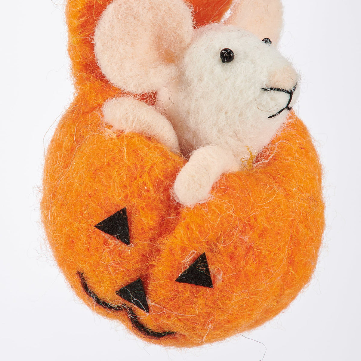 A white felt mouse with black eyes inside an orange needle-felted pumpkin from kathys halloween collection