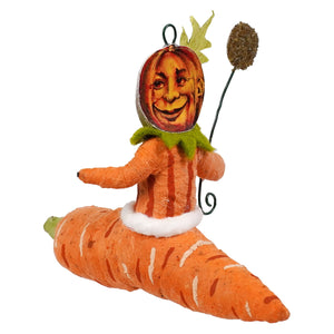 Orange carrot-shaped pumpkin person ornament with green leafy collar and white fur trim, perfect for krampus freestand decor