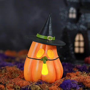 Orange pumpkin witch luminary by bethany lowe design with black hat and glowing yellow face witch luminary lights