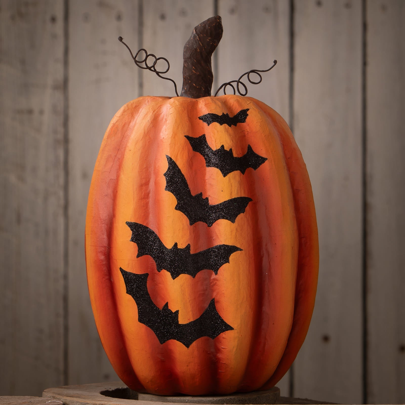 Orange pumpkin with bats decorative piece featuring black bat decals and a twisted wire stem for halloween pumpkins and gourds