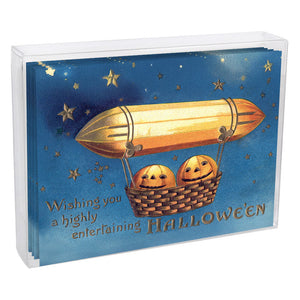 Pumpkins in air balloon greeting card set with golden airship and smiling jack-o-lanterns in a starry sky design
