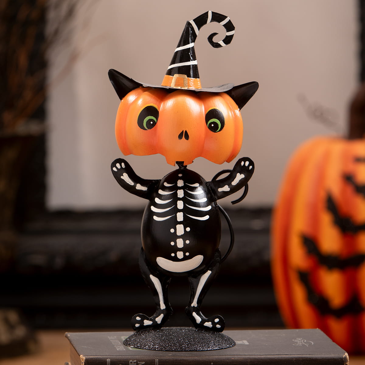 Punkin head skelly cat figurine with orange pumpkin head wearing black and white witch hat skeleton decor figure
