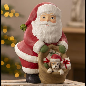 Red and white glittery hand painted paper mache santa figure holding a sack with a puppy by bethany lowe designs