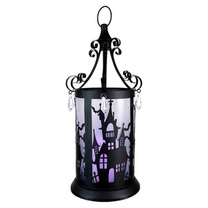 Decorative Halloween lantern with a spooky haunted house silhouette and hanging crystals.
