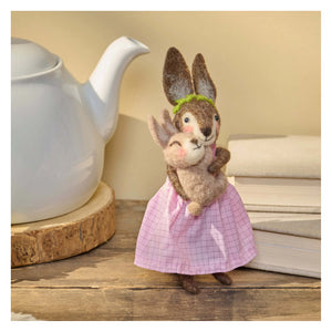 A charming needle-felted rabbit mother critter wearing a pink checkered dress and green headband holding a smaller bunny
