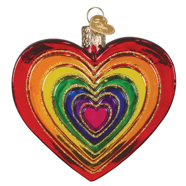 A vibrant rainbow heart ornament made of glass with glittered gold edges and a colorful pink glittered heart design
