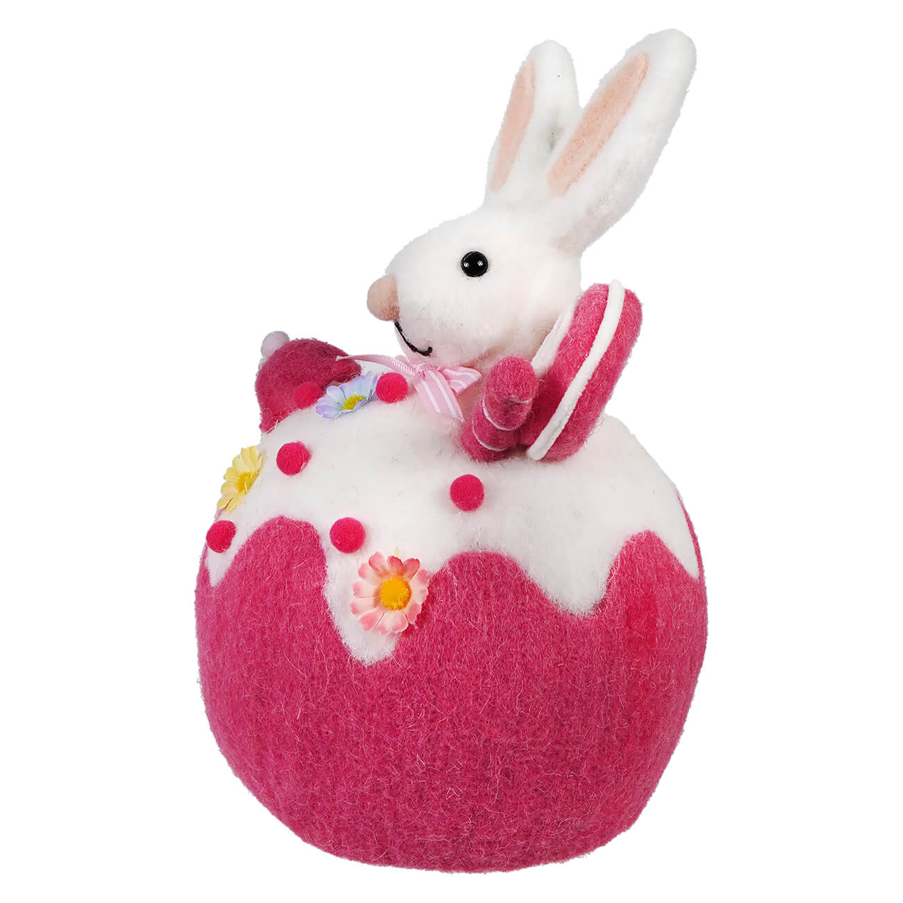 White bunny sitting atop a pink decorated Easter egg ornament.