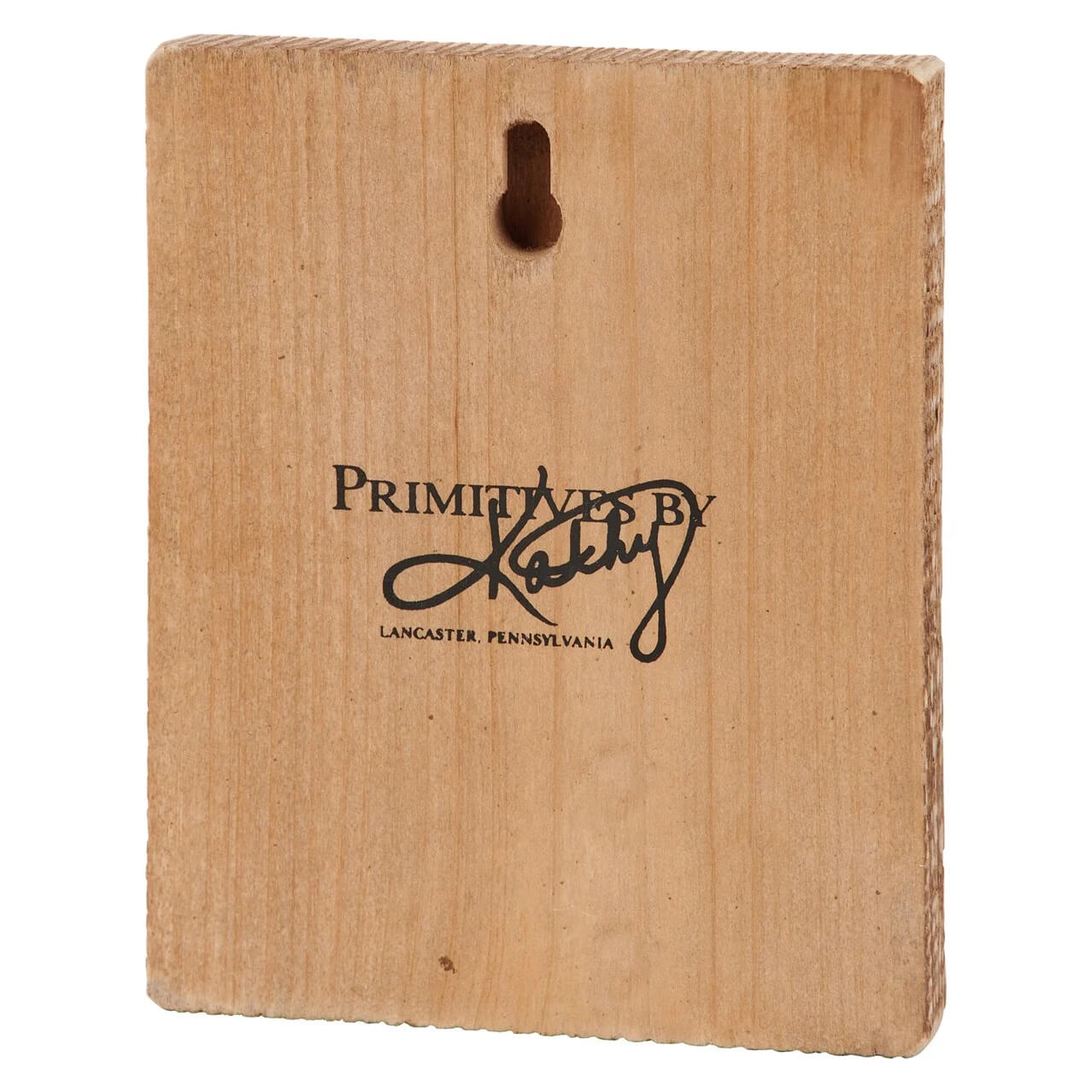 Wooden plaque with ’Primitives by Kathy’ branding from Lancaster, Pennsylvania.