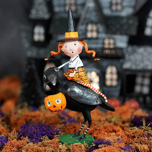 A lori mitchell halloween whimsical witch figurine with orange pigtails riding a black crow holding a pumpkin basket raven’s flight