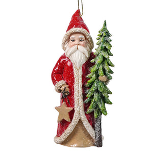 Red coat santa holding tree and star holly santa ornament with snow dusted green pine tree for holiday decor