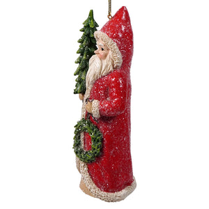 Red coat santa holding tree and wreath ornament with glittery red coat perfect for holly santa ornament or santa ornaments collection