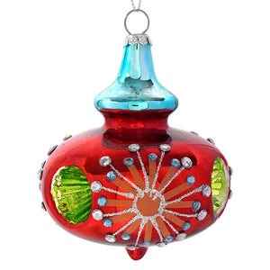 A vibrant red glass reflector kismet ornament with turquoise top and sparkling silver blue rhinestones in sunburst pattern