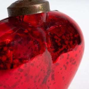 Vibrant red glass heart ornament with metallic cap and vintage-inspired finish perfect for year-round decor