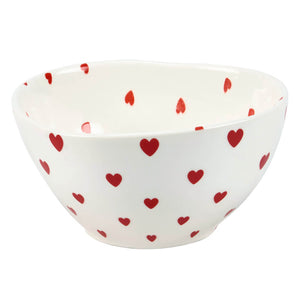 White ceramic bowl decorated with red heart patterns.