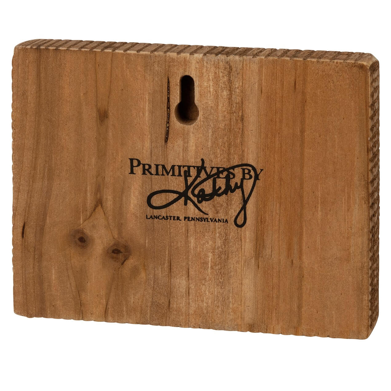 Wooden block with ’Primitives by Kathy’ branding from Lancaster, Pennsylvania.